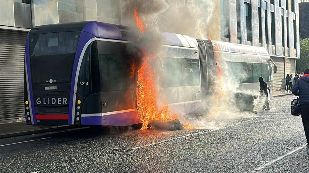 A Glider bus, set fire by protesters, on the Newtownards Road in east Belfast