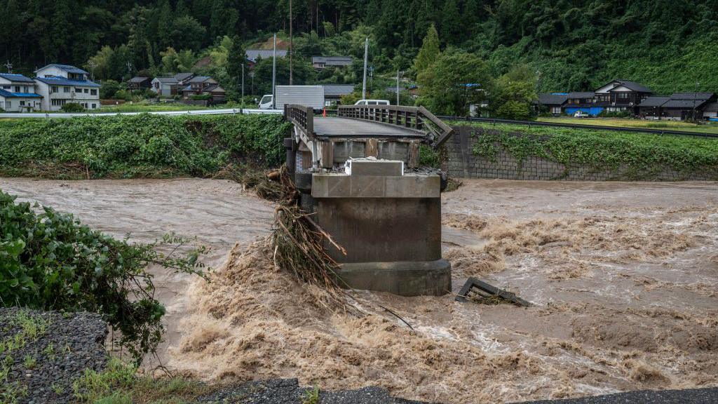 A collapsed bridge is seen following heavy rain in Wajima city, Ishikawa prefecture on September 22, 2024