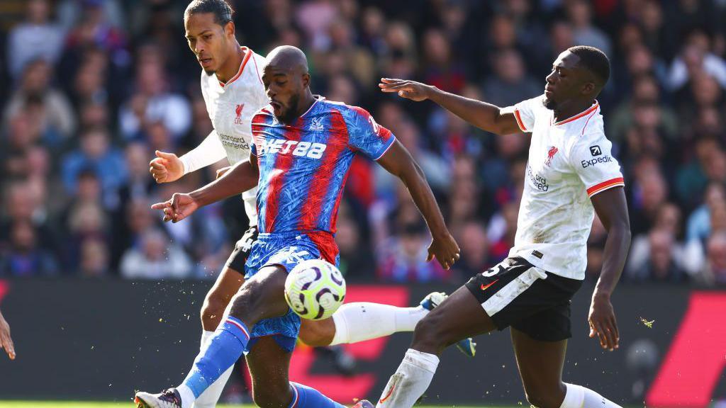 Virgil van Dijk and Ibrahima Konate of Liverpool challenge Jean-Philippe Mateta of Crystal Palace for the ball during their Premier League game at Selhurst Park