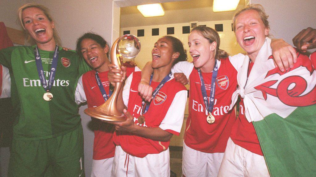 Arsenal players celebrate in the dressing room
