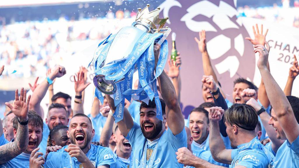Josko Gvardiol of Manchester City lifts the Premier League trophy