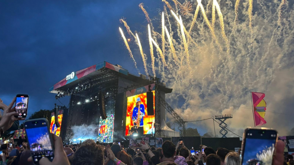 Fireworks above the stage at Big Weekend, Sam Fender on stage and crowd in front.