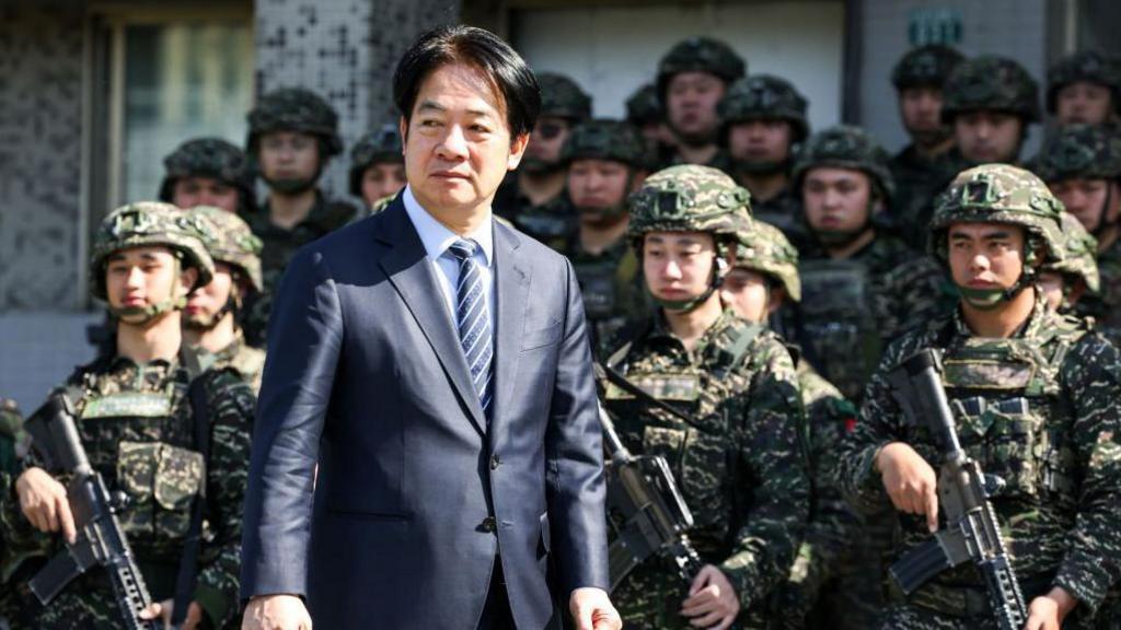Taiwan's President Lai Ching-te inspects the troops taking part in the Rapid Response Exercise during a visit at the Songshan military airbase in Taipei on March 21, 2025. 