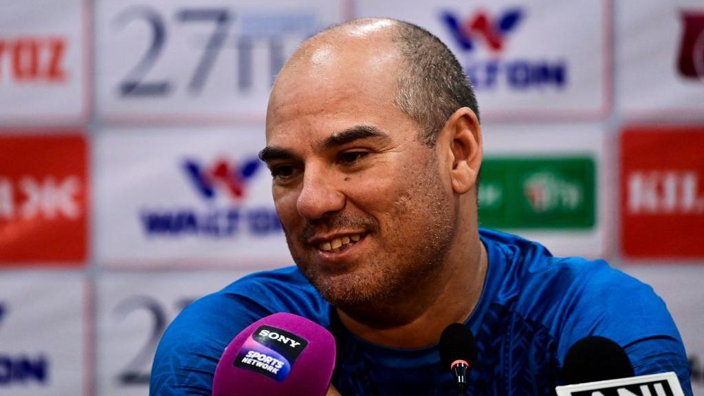 New Hampshire coach Russell Domingo speaks at a press conference 