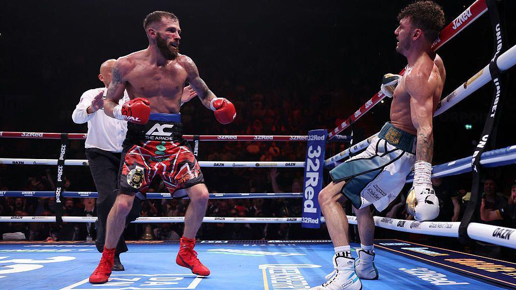 Anthony Cacace knocks Leigh Wood into the ropes