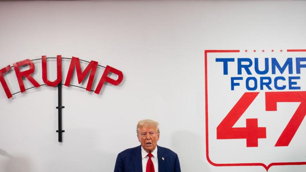 Donald Trump at a local Republican field office in Michigan in August