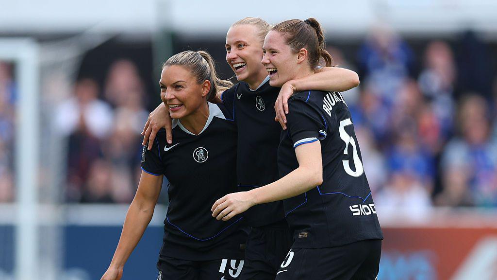 Aggie Beever-Jones of Chelsea celebrates scoring her team's first goal with teammates Johanna Rytting Kaneryd and Veerle Buurman.