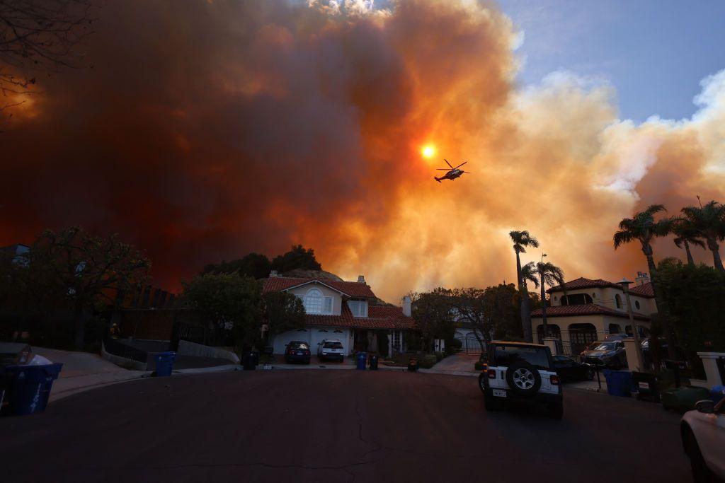 Plumes of smoke are seen as a brush fire burns in Pacific Palisades.