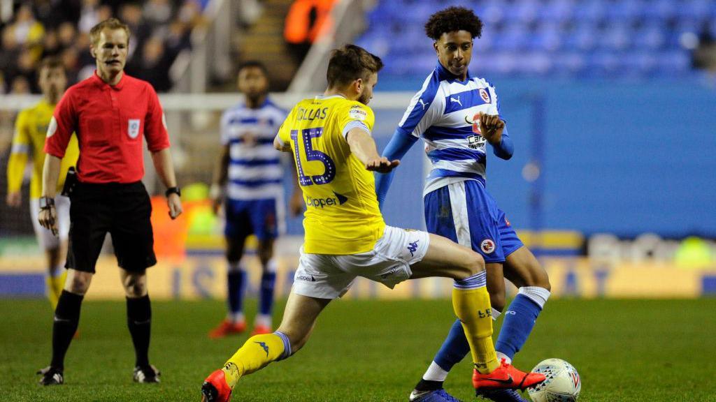 Michael Olise (r) in his Reading debut against Leeds in March 2019 being challenged by Stuart Dallas