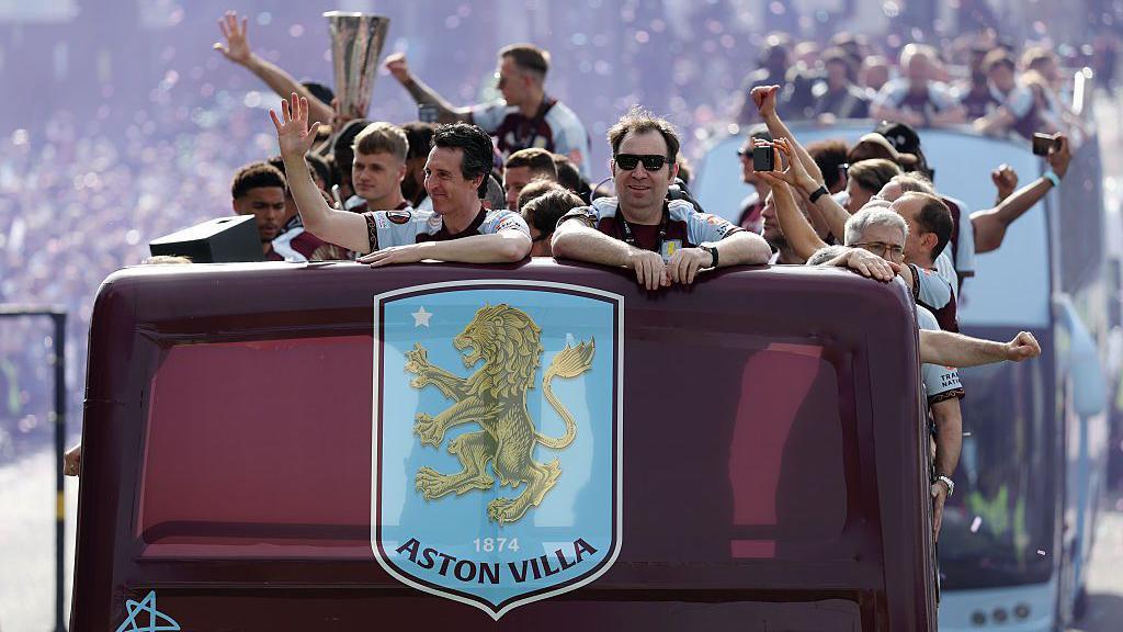 Unai Emery at the front of the parade bus