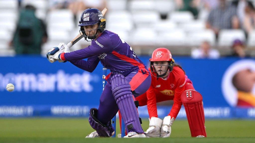 Northern Superchargers batter Phoebe Litchfield switch hits a ball for six runs during The Hundred