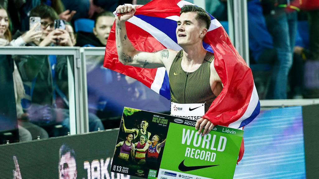 Jakob Ingebrigtsen celebrates after setting the world indoor mile record in France in February