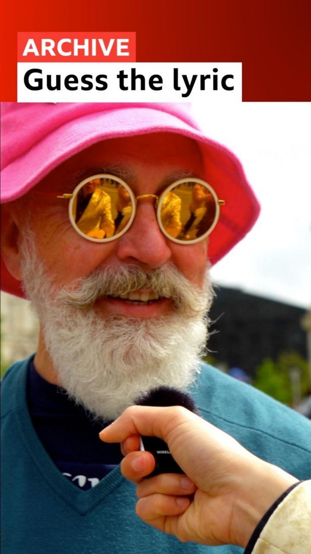 Man wearing pink hat in Liverpool