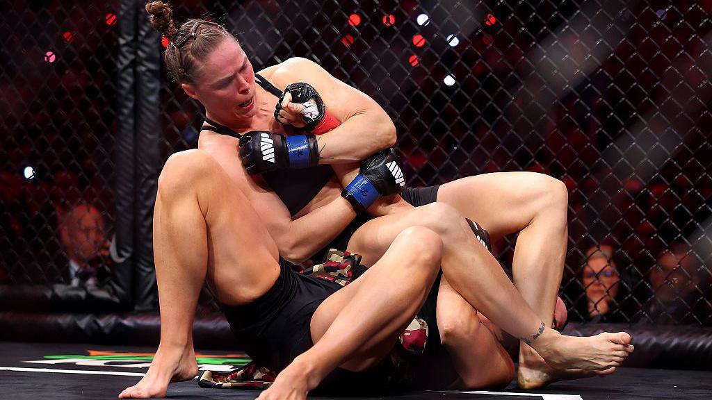 Ronda Rousey armbars Gina Carano