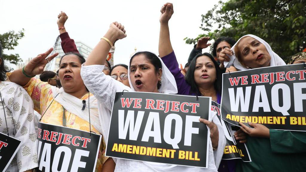 Activists from The All India Trinamool Congress take part in a protest meeting in Kolkata, India, on November 30, 2024, demanding the withdrawal of the Central Government's WAQF Amendment Bill 2024. The 2024 Waqf Amendment Bill seeks to reform the registration process for Waqf properties through a centralized portal. It proposes several reforms, including establishing a Central Waqf Council alongside State Waqf Boards with representation for Muslim women and non-Muslim representatives. (Photo by Rupak De Chowdhuri/NurPhoto via Getty Images)