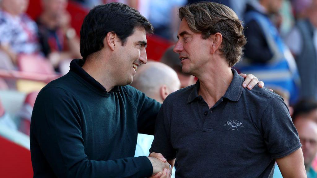 Andoni Iraola shaking hands with former Tottenham manager Thomas Frank