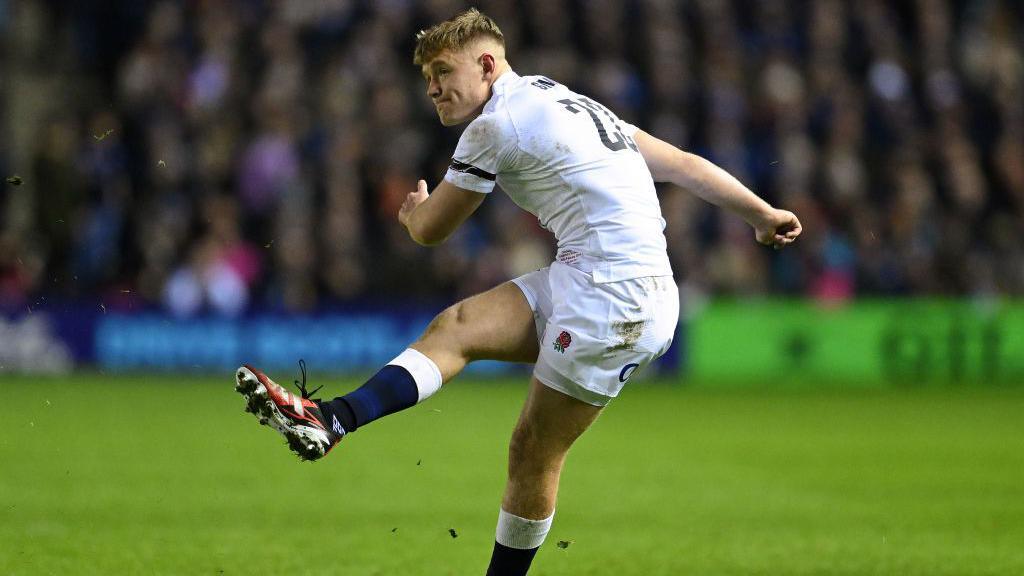 Fin Smith kicks for England during the Six Nations