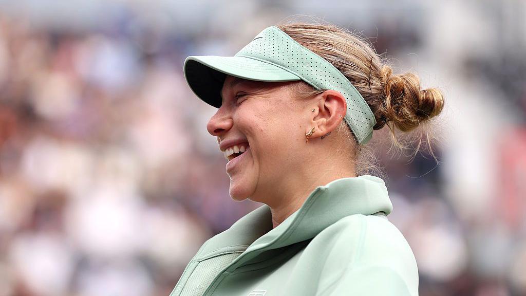 Amanda Anisimova of United States reacts following victory over Laura Siegemund