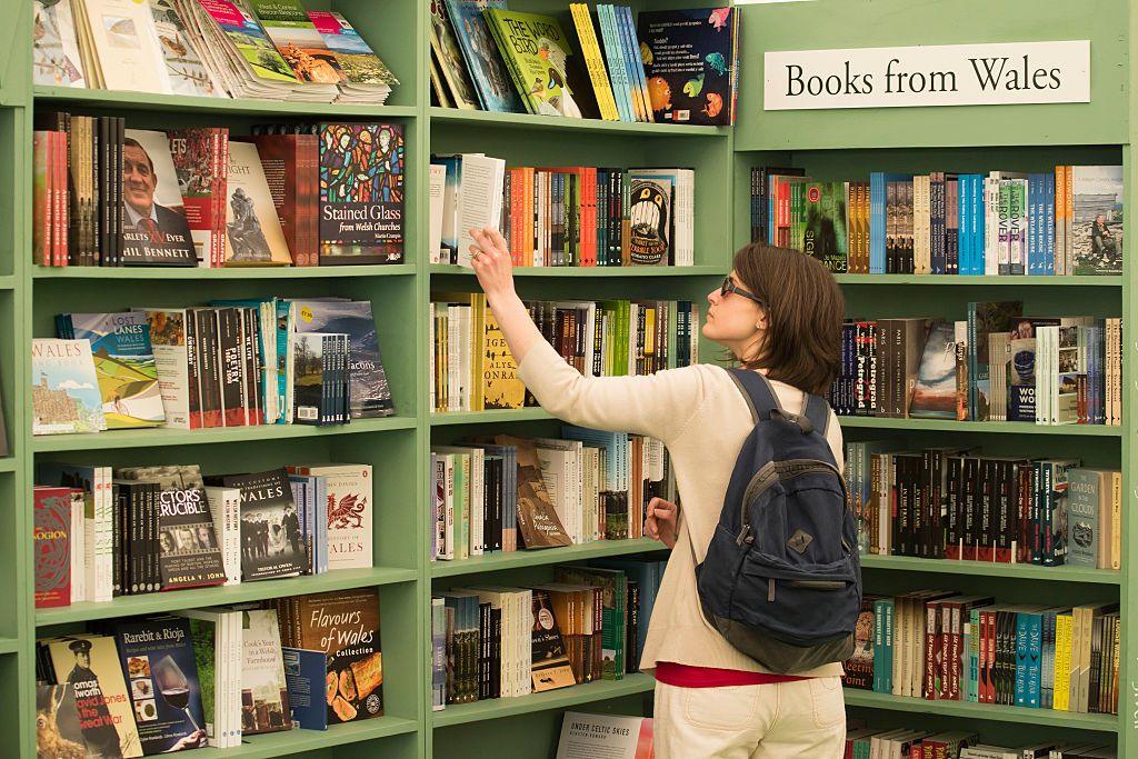 A woman browses a bookshop at Hay Festival