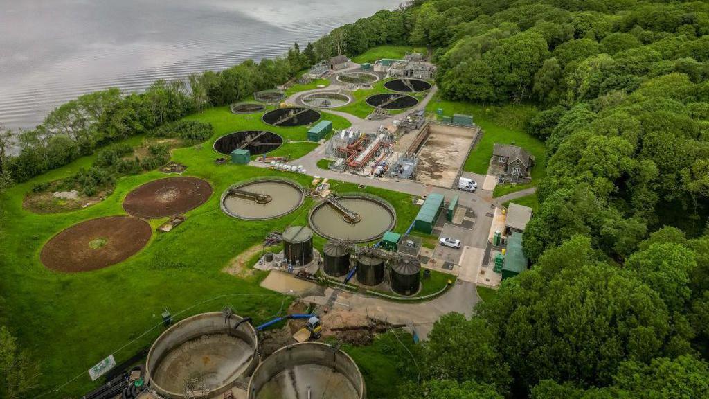 An aerial view of Windermere treatment plant, located next to the lake, showing the large circular settlement tanks