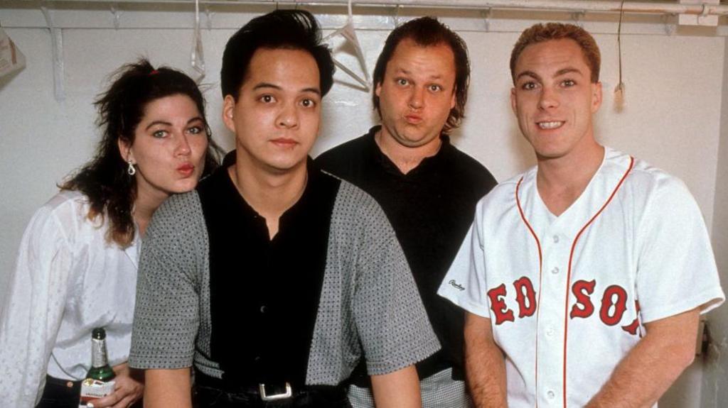 The original line-up of Pixies, circa 1989, strike goofy poses backstage at a concert