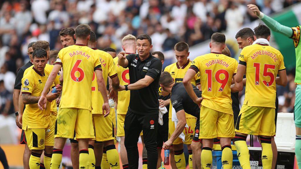 Paul Heckingbottom, Manager of Sheffield United, interacts with their side during the Premier League match between Tottenham Hotspur and Sheffield United