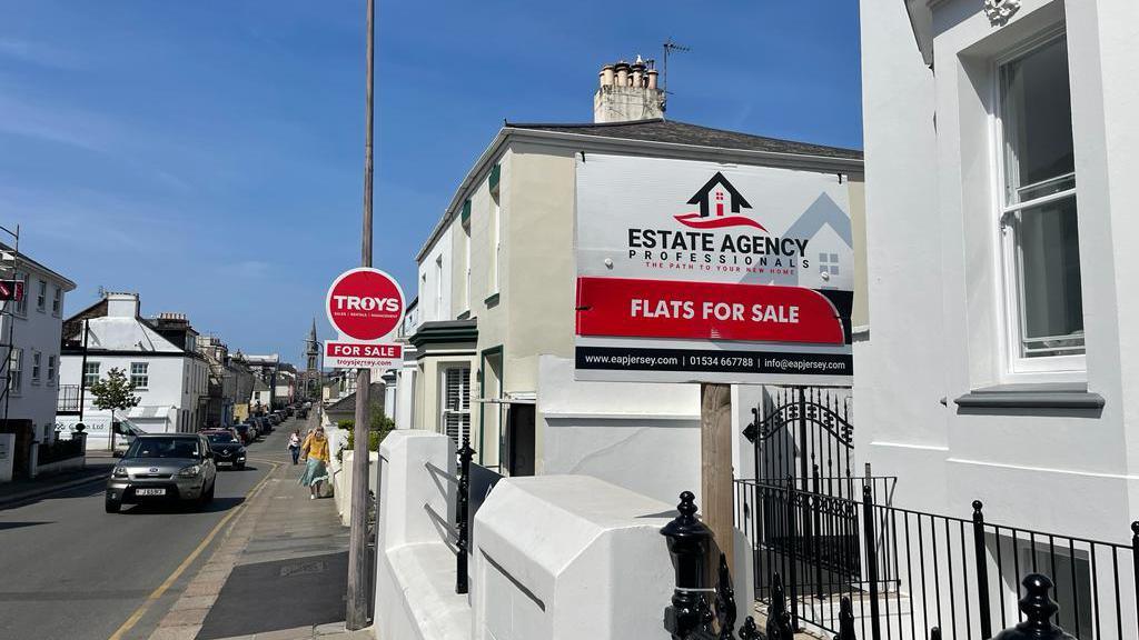 Housing sale signs in St Helier