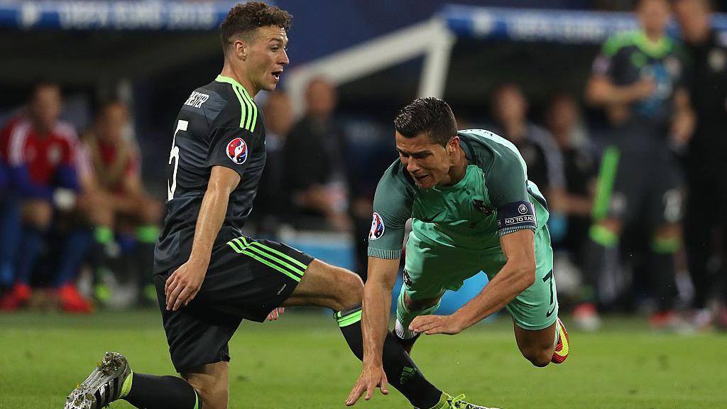 James Chester of Wales challenges Cristiano Ronaldo of Portugal during the UEFA Euro 2016 Semi Final match between Portugal and Wales