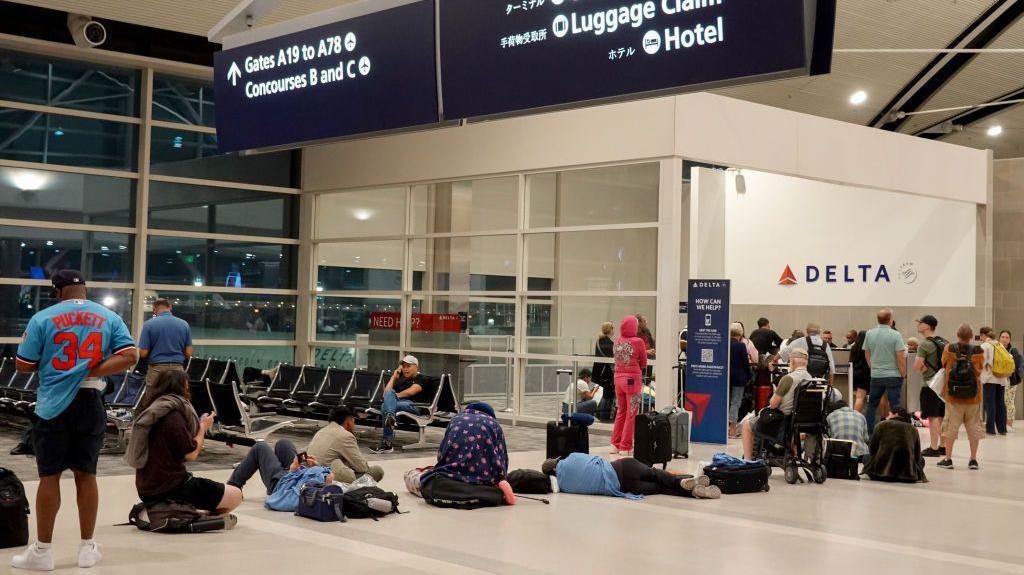 Tired passengers at an airport in Detroit