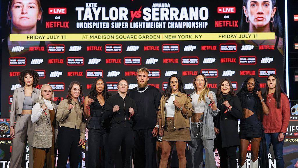 Jake Paul in the middle of all the women boxers signed to MVP including Katie Taylor, Amanda Serrano, Ellie Scotney and Alycia Baumgardner