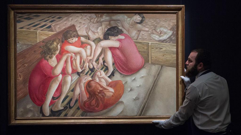 A Sotherby's art handler poses with Sir Stanley Spencer's Christ Preaching at Cookham Regatta: Punts by the river.