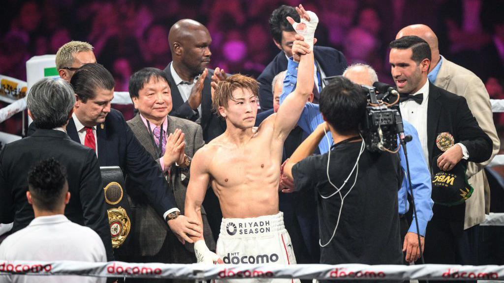 Naoya Inoue has his hand raised in Tokyo