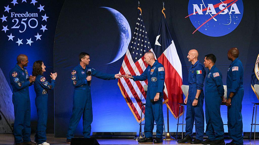 Artemis II astronauts greet the Artemis III astronauts