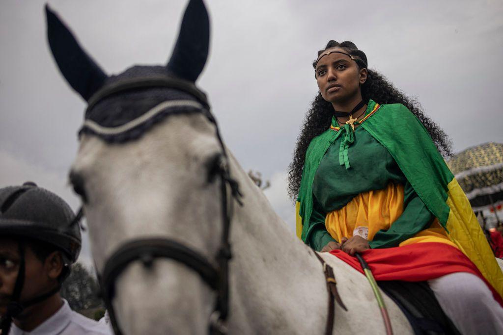 A woman dressed in royal attire parades on a horse during celebrations of the Ethiopian Orthodox holiday of Meskel, in Addis Ababa, on September 26, 2024.