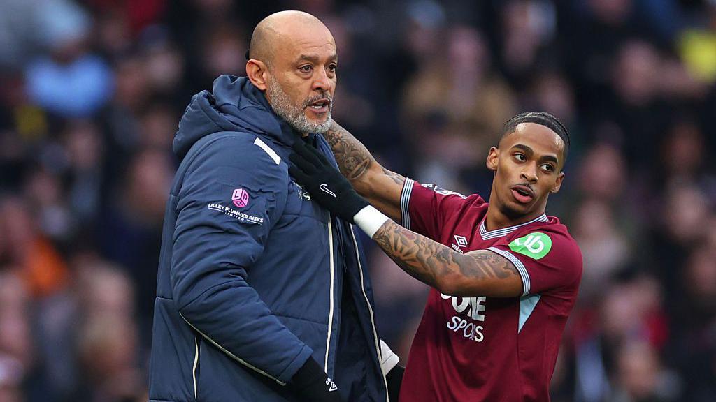 West Ham United players celebrating a goal during their Premier League match against Tottenham Hotspur.