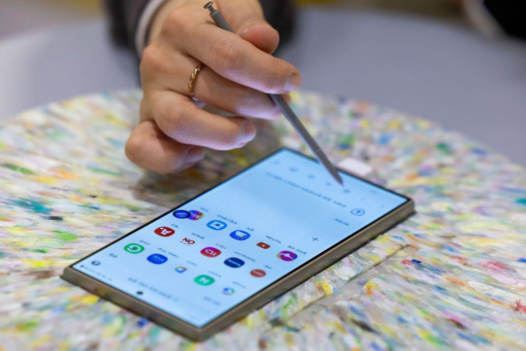 A stylus runs across the screen of a Galaxy S24 smartphone from Samsung.