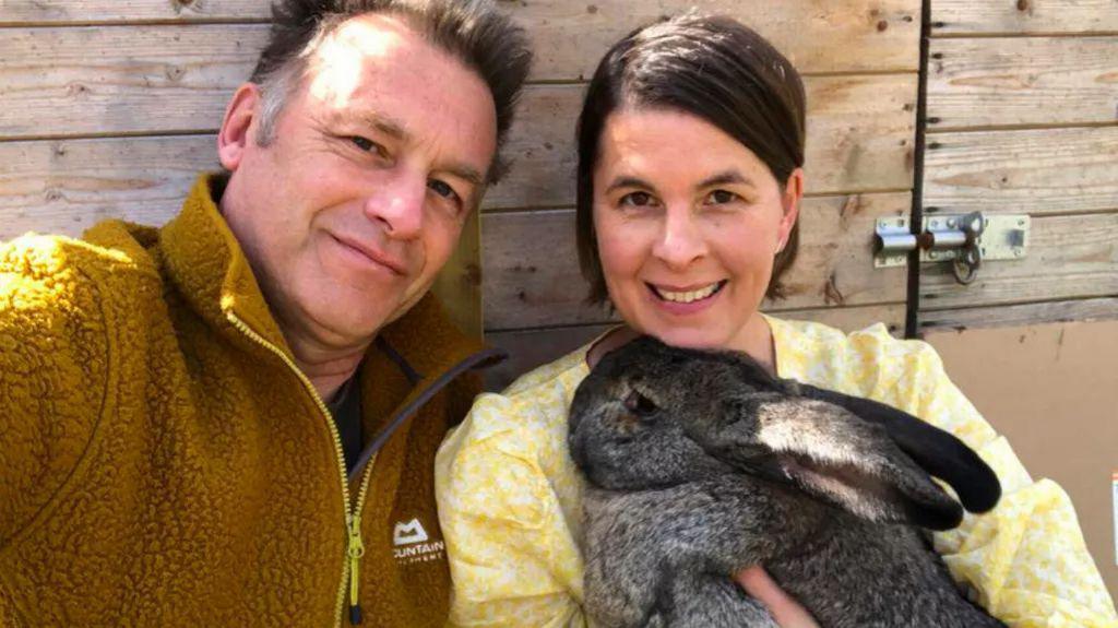 Chris Packham with his partner Charlotte Corney, who is holding a rabbit with big ears
