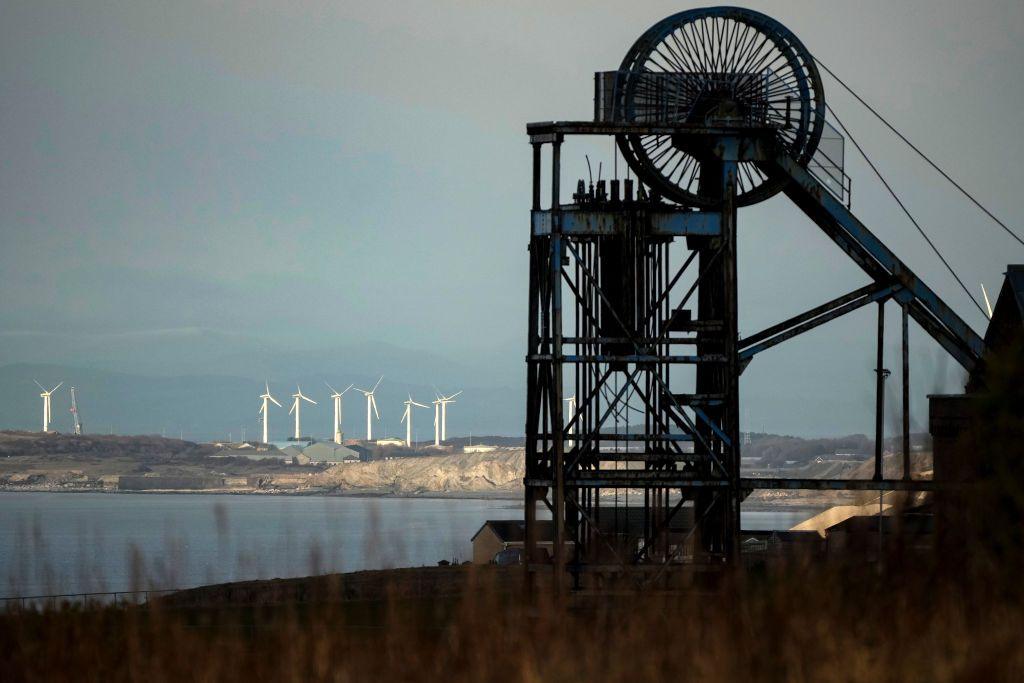 The winding wheel of Haig Colliery Mining Museum adjacent to the West Cumbria Mining (WCM) offices who been given approval to once again extract coal in Whitehaven, England. 