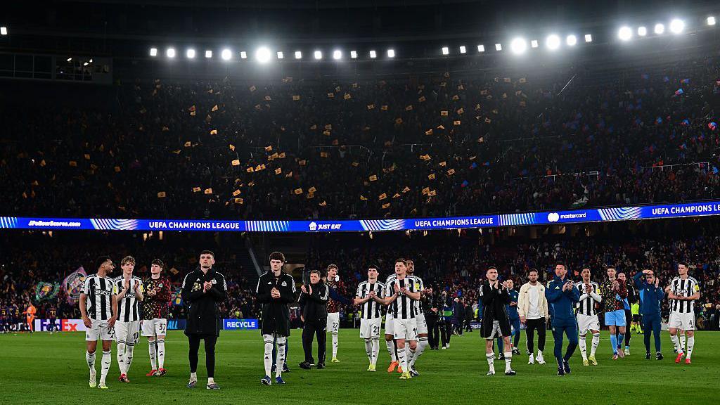 Newcastle United players applaud their away support