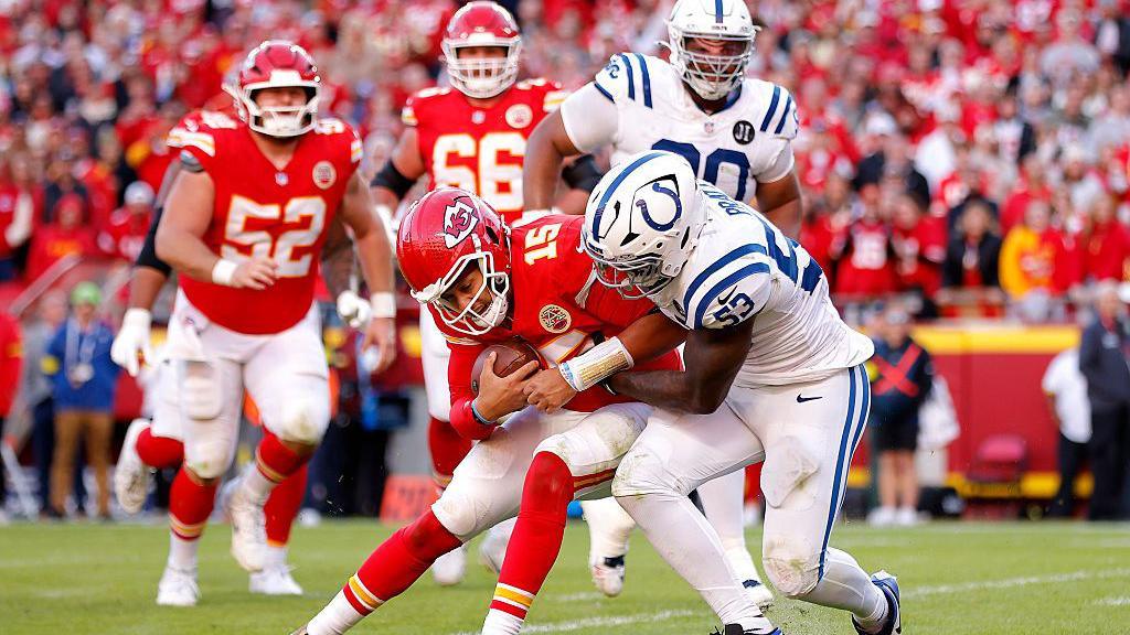 Patrick Mahomes is tackled by the Indianapolis Colts in the NFL