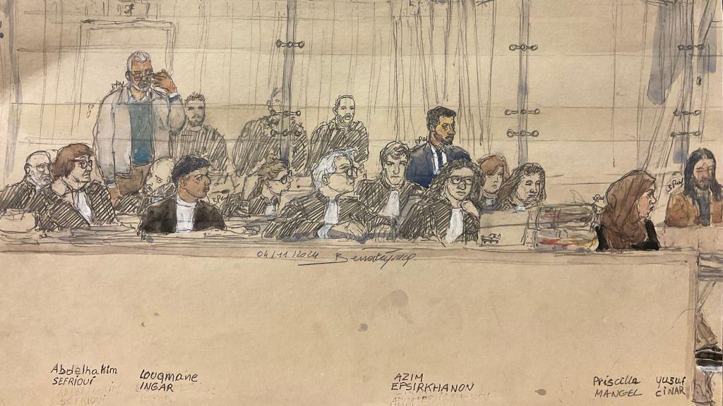 A court sketch of five of the defendants (L-R) Abdelhakim Sefrioui, Louqmane Ingar, Azim Epsirkhanov, Priscilla Mangel and Yusuf Cinar sitting during the trial during a hearing on 4 November 2024