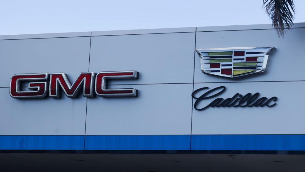 GMC and Cadillac logos