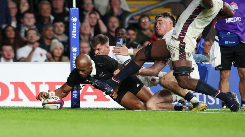 Mark Tele'a stretches to score a try