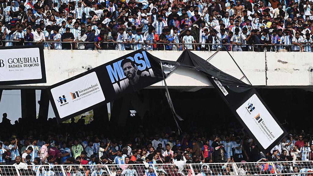 Angry fans vandalise a banner at Salt Lake Stadium 