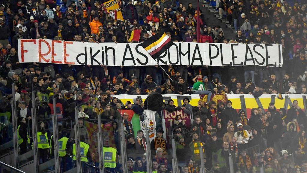 Roma supporters protest against the Freidkin Group