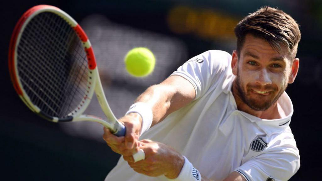 Cameron Norrie playing a two-handed shot