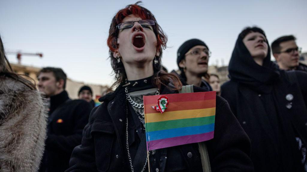 Protester in Budapest holds a rainbow flag after Hungary bans Pride marches