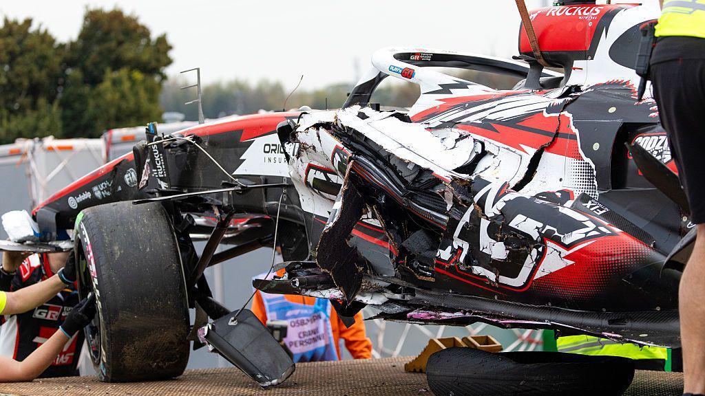 The wreckage of Oliver Bearman's Haas is loaded onto the recovery truck at Suzuka