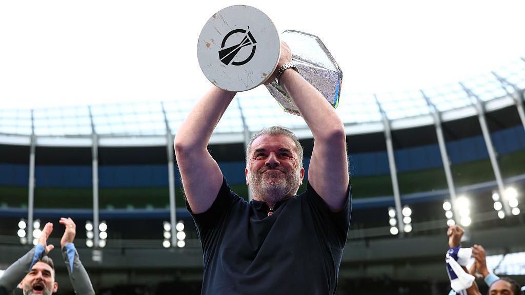 Ange Postecoglou lifts the Europa League trophy