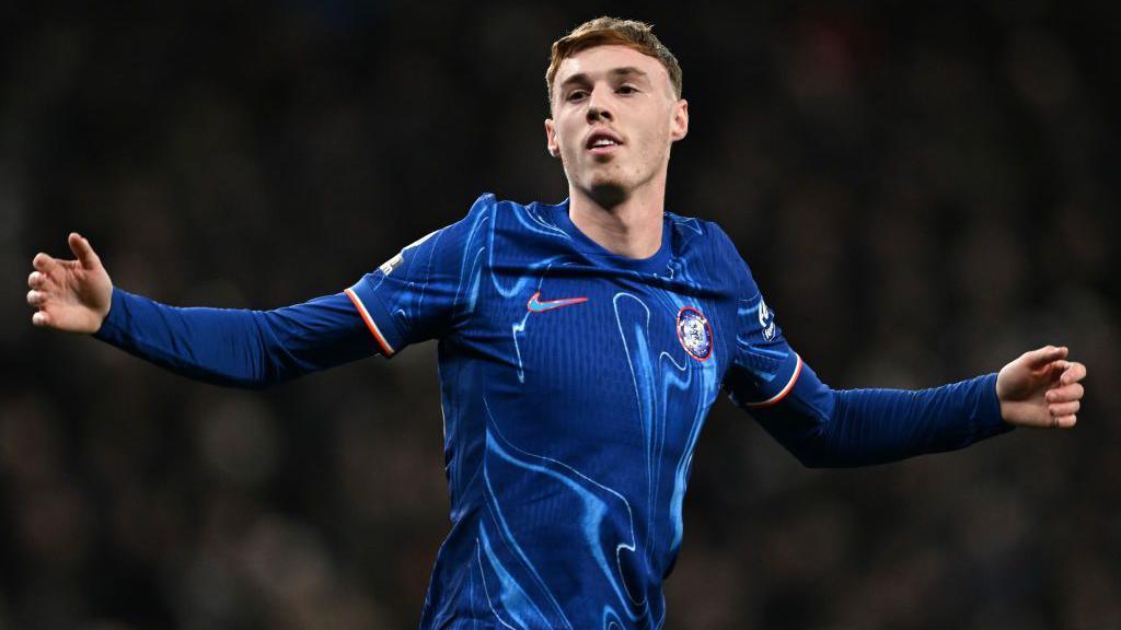 Cole Palmer celebrates after scoring a penalty against Tottenham